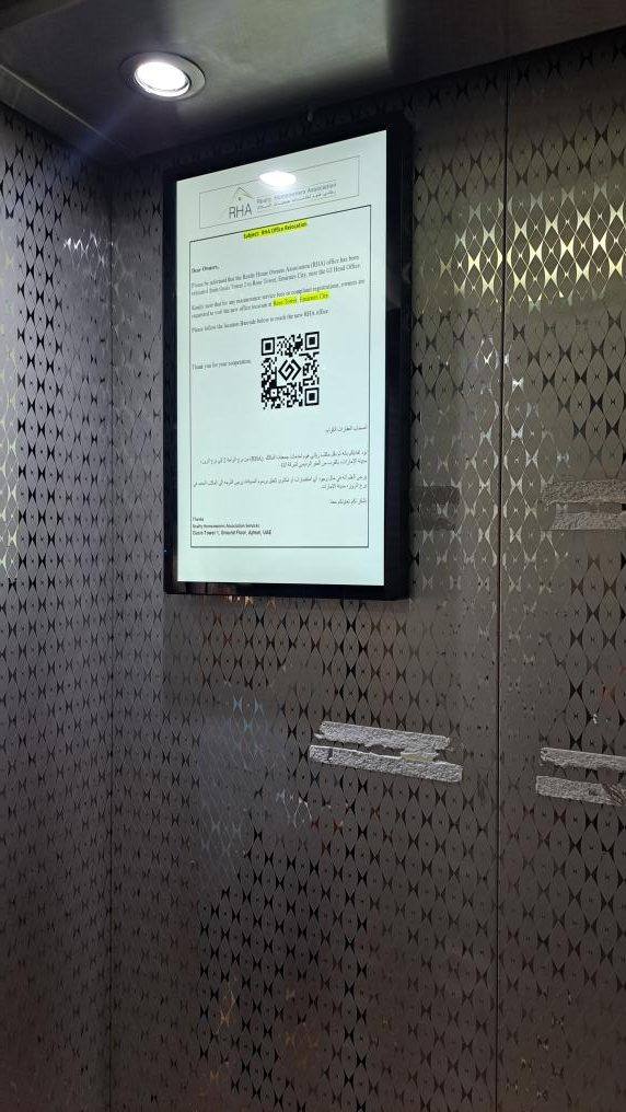 RHA resident notice with QR code shown on a lift screen